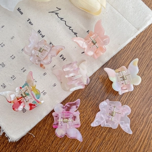 Lot de sept jolies pinces à cheveux papillon aux couleurs pastel marbrées et translucides