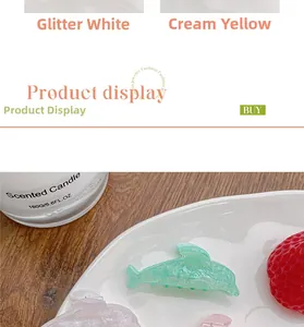 Detail showing dolphin-shaped acrylic hair clips in pastel colors with subtle glitter