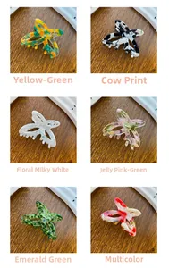 Detailed grid of hollow butterfly hair claw clips in six varied acetate patterns and colors