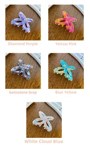 Detailed views of acetate butterfly hair claws in purple, pink, gray and blue patterns