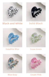 Assorted heart-shaped acetate hair claws in six marble and floral patterns