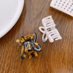 Medium acetate hollow butterfly hair claw clips in tortoiseshell and pearl white finishes