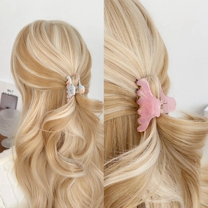 Colorful acetate claw clips in marble and tie-dye patterns for women's hairstyles