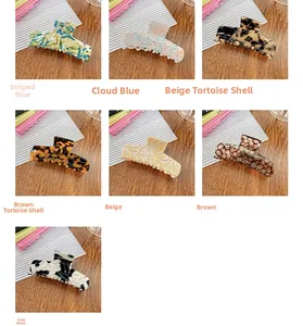 Collection of seven acetate hair claws in assorted marble and tortoise patterns