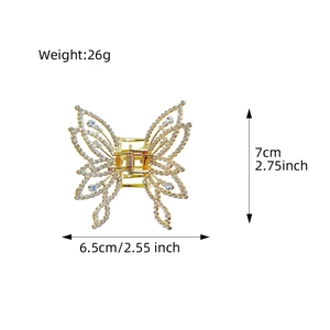 Golden butterfly hair claw with pearls and rhinestones measuring seven centimeters