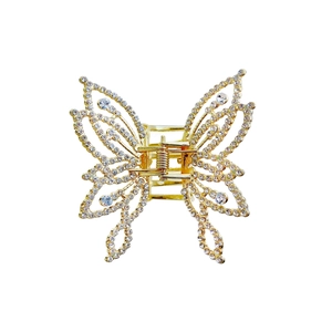 Elegant butterfly hair claw with gold hollow wings and sparkling white rhinestones