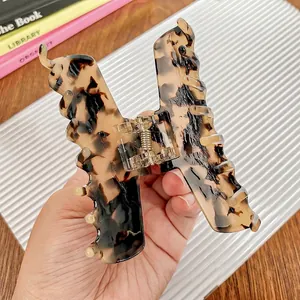 Large tortoiseshell butterfly hair claw clip with acetate finish for elegant hairstyles