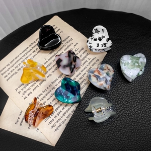 Set of 8 colorful acetate heart hair claws in marble and solid patterns for women
