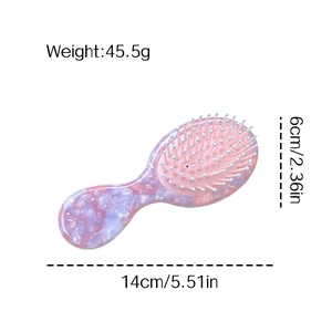 Brosse à cheveux en acétate marbre rose, dimensions 14x6 cm et poids 45,5 g