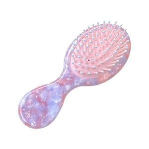 Brosse à cheveux en acétate marbré rose et violet avec picots de massage bleu clair
