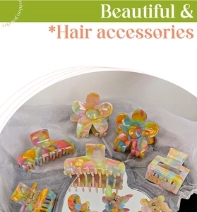 Detailed view of colorful acetate hair claws in flower and geometric marble patterns