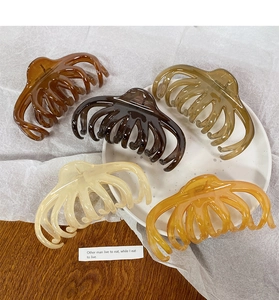 Set of five large resin octopus hair claws in various translucent earthy colors