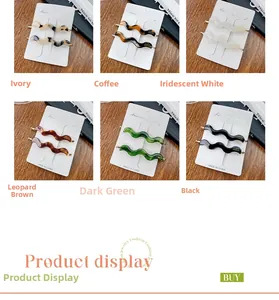 Close-up of wavy acetate hair clips in multiple tortoiseshell patterns on display card