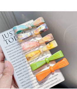 Set of 6 colorful acetate bow hair clips with marble texture and polished finish