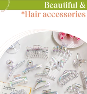 Macro detail of various iridescent mermaid pearl hair claws with a rainbow finish