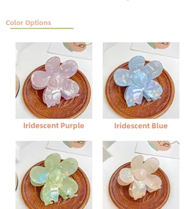 Floral hair claw clips in pearlescent purple, blue, green and white colors with marble texture