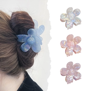 Floral acetate hair claw clip with pearlescent mermaid finish for elegant styling