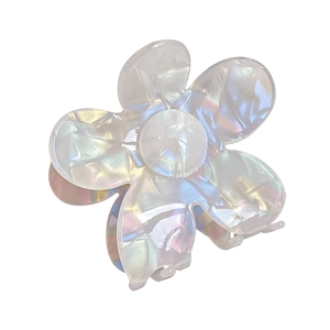 Iridescent white flower hair claw clip with pearlescent finish and acetate texture