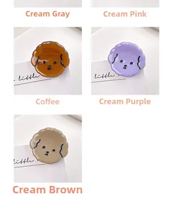 Detail view of acetate puppy hair clips in cream gray, pink, coffee, purple, and brown tones