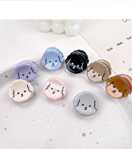 Detailed set of eight colorful mini puppy hair claws in various acetate finishes