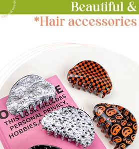 Detail view of Halloween hair clips set featuring pumpkin, spider web, and checkered patterns