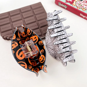 Halloween acetate hair claw set with pumpkin smile and spider web patterns