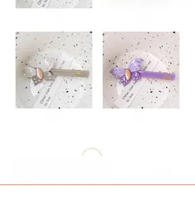 Detail of four acetate butterfly hair clips with crystals and FRANCE Handmade engraving