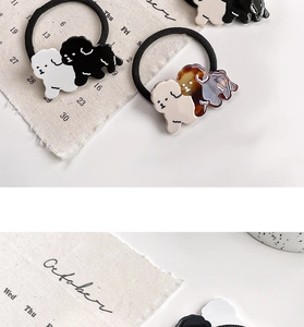 Detailed close-up of cute puppy acetate charms on high-elastic hair ties in multiple colors