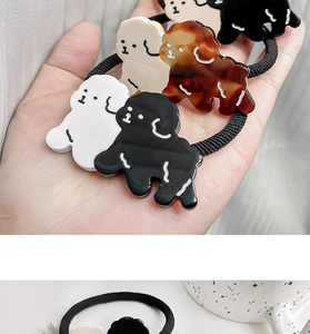 Detail showing various colors of cute dog acetate hair ties with high elastic black bands