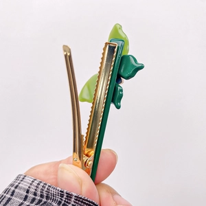 Classic green acetate leaf hair clip with rhinestones and golden duckbill metal grip