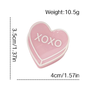 Pince à cheveux cœur rose en acrylique avec texte XOXO, hauteur 3,5cm et largeur 4cm
