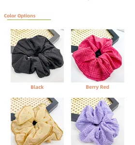 Detailed grid showing waffle-textured large fabric scrunchies with golden edge trim in four colors