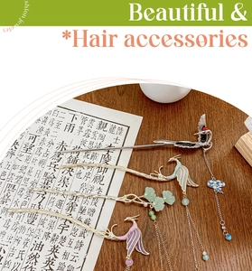 Detail of four Chinese style hairpins with phoenix tassels and ginkgo leaf pendants