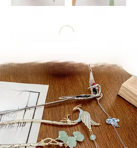 Detail of Qingluan hair stick with ginkgo jade leaf and long tassels in Chinese style