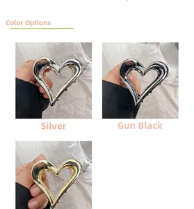 Detailed view of hollow heart metal hair claws in silver, gun black and gold finish