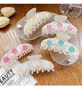 Set of five elegant snowflake hair claws in cream acetate with colorful rhinestones