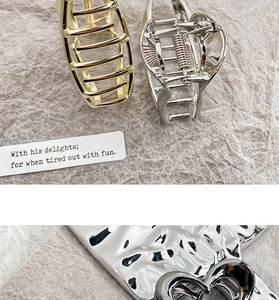 Detail of hollow heart metal hair claw clips with smooth teeth and spring mechanism