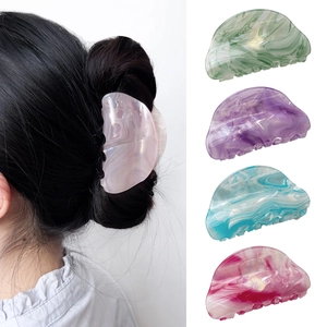 Elegant semi-circular acetate hair claws with marble texture in multiple pastel colors