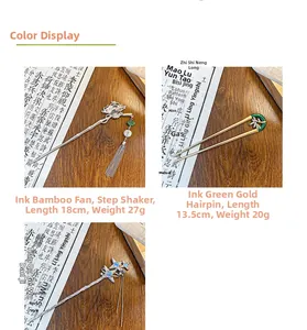 Detail view of Chinese style tassel fan hairpin and dark green jade metal hair fork
