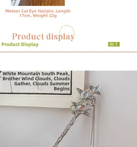Detail of fan-shaped star hair pin with iridescent cat eye stones and metal tassels
