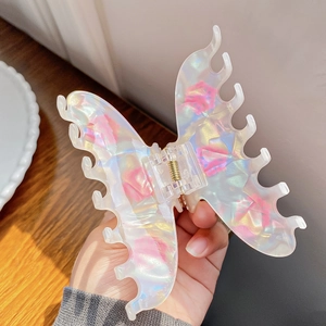 Elegant large snowflake shark hair claw clip with pearlescent finish and pink floral patterns