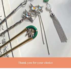 Detailed close-up of new Chinese style tassel hairpins with rhinestones and star charms