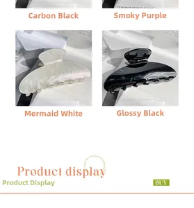 Detail showing various colors of glossy acetate hair claws in white and black finishes