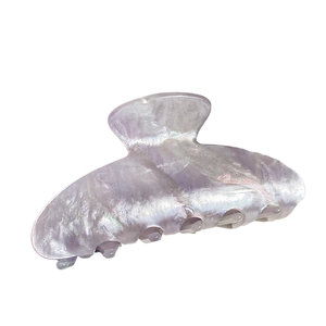 Elegant large pearlescent lilac hair claw clip with iridescent finish and glitter