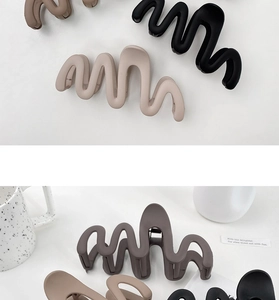 Macro detail of large wave matte hair claws in various earthy tones and textures