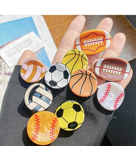 Détail de pinces à cheveux ballons de sport avec football, basket-ball et baseball