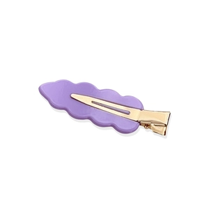 Purple wavy acrylic hair clip with gold metal duckbill clip on a white background