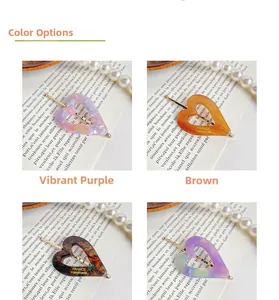 Macro shot of vintage acetate heart hair clips in tortoise, amber, and purple colors
