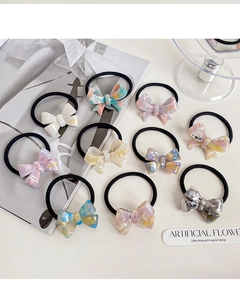 Close-up of 10-piece acetate bow hair ties set with premium marble textures and elastic bands