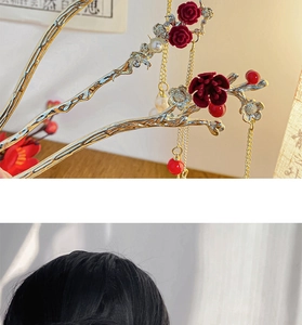 Detail of golden plum blossom hair pin with red velvet flowers and hanging tassels